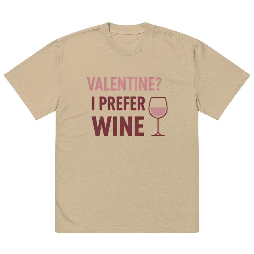 Front view of faded khaki t-shirt with pink “Valentine? I Prefer Wine” typography and wine glass icon graphic printed on chest.