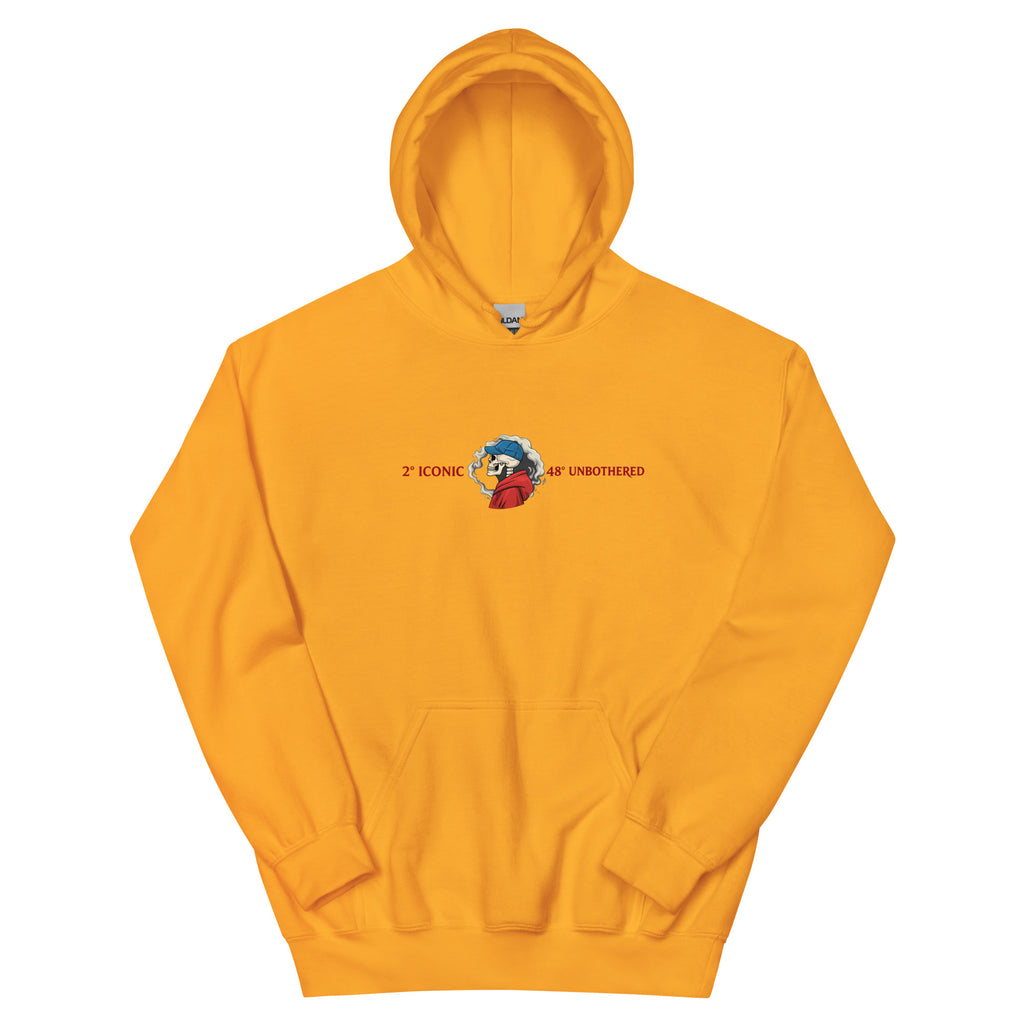 Yellow oversized streetwear hoodie front view with small chest skull graphic and red “Iconic / Unbothered” text print, neutral background.