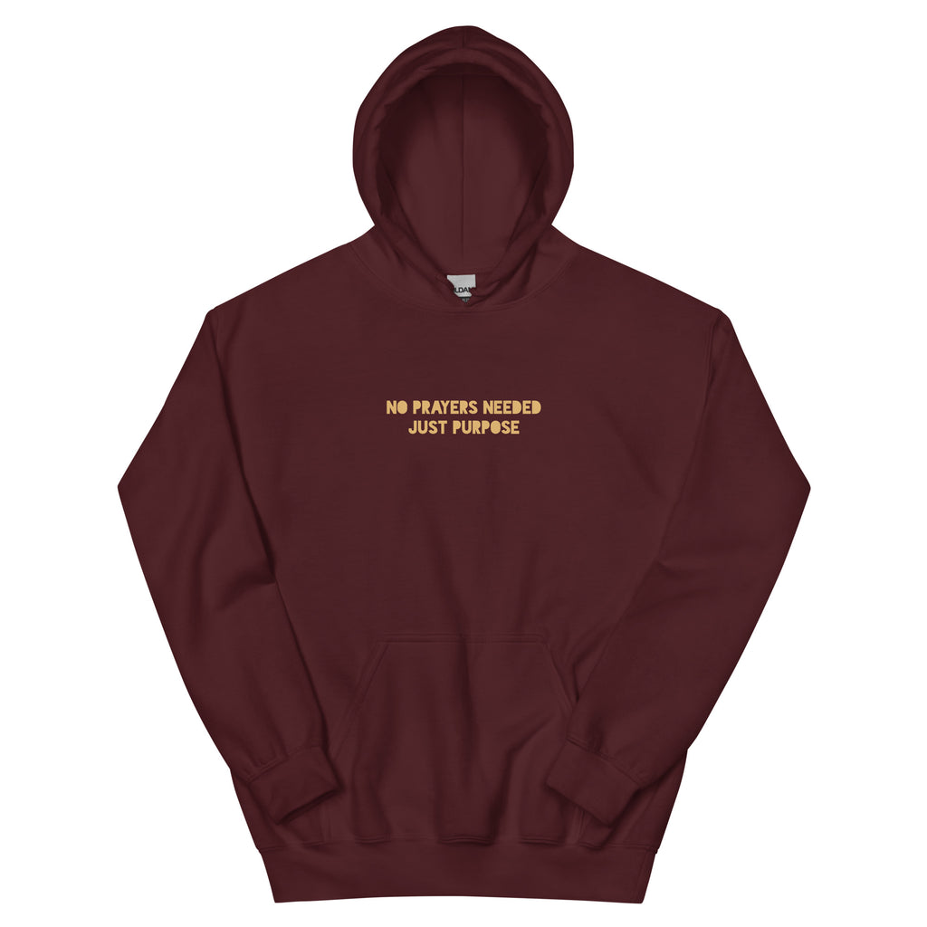 Maroon unisex hoodie front view with “No prayers needed just purpose” text design