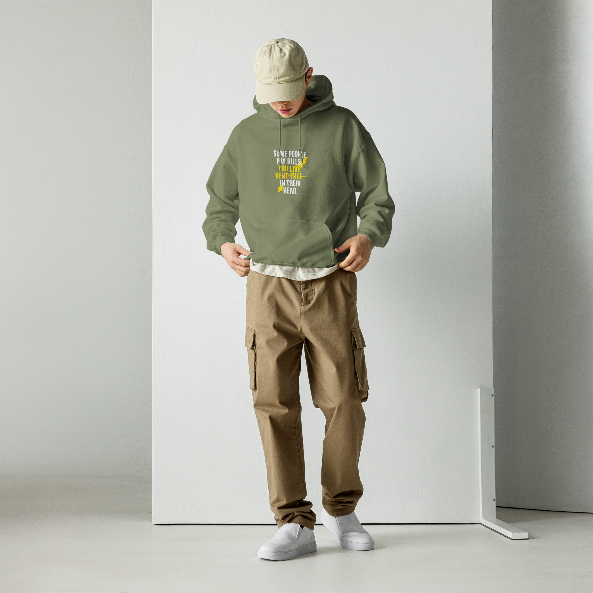 male model full body front view wearing oversized green hoodie urban streetwear look