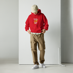 male model front pose wearing oversized red graphic hoodie rent free design urban streetwear outfit