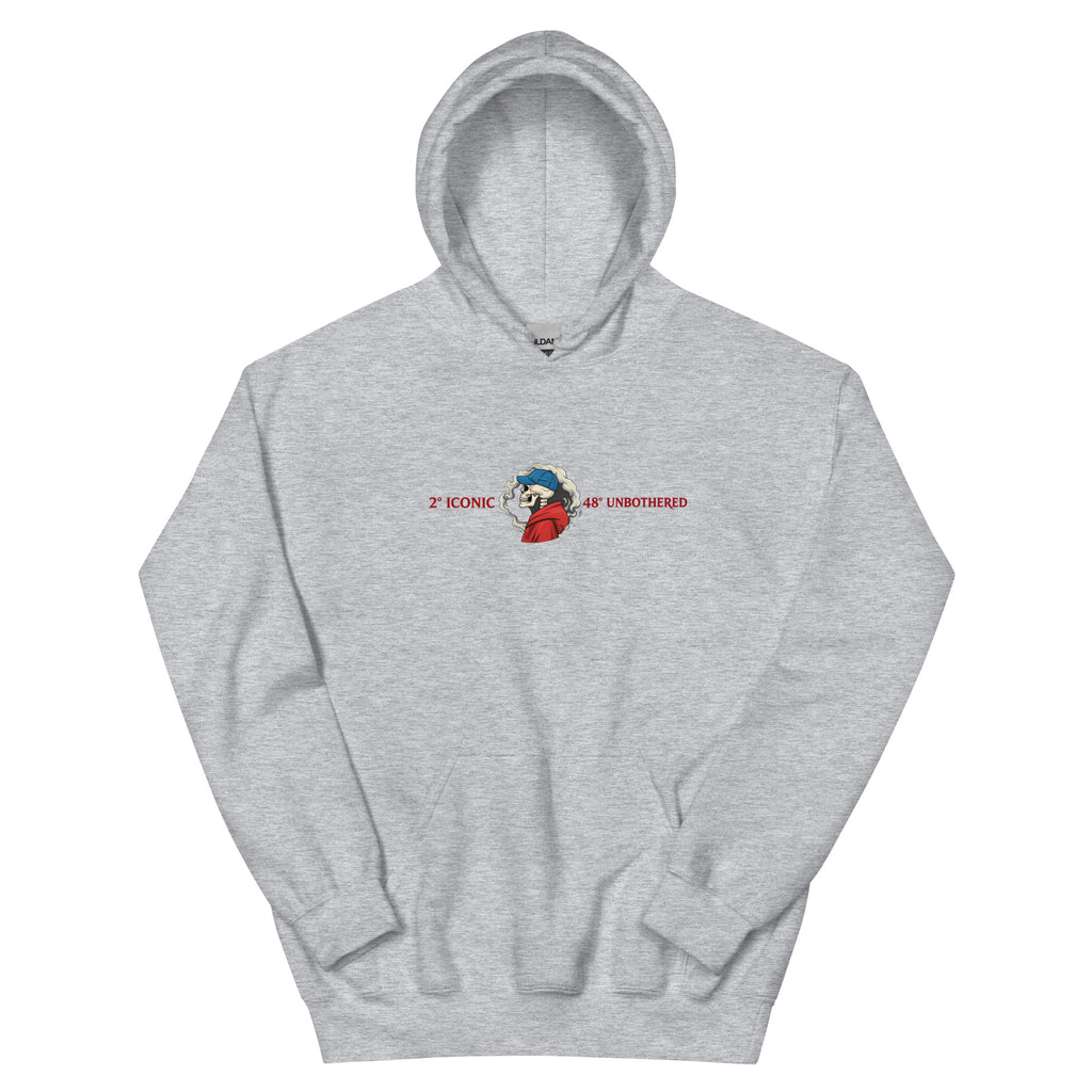 Sport grey oversized streetwear hoodie front view with small chest skull graphic and red “Iconic / Unbothered” text print, neutral background.