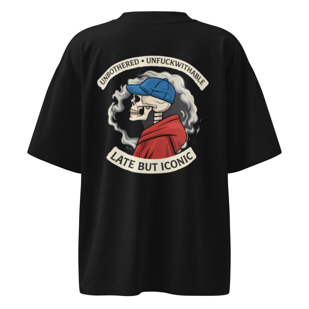 Black oversized T-shirt with large back graphic illustration and bold statement typography, urban streetwear aesthetic.