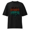 Black oversized streetwear T-shirt featuring bold gothic “Not Here to Impress You” typography in orange and teal with subtle shadow graphic on the front