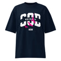 French navy oversized streetwear T-shirt with bold white “GOD” varsity typography, “WHERE IS” text across the center, “NOW” below, and pink bird silhouettes graphic on the front