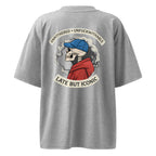 Light grey oversized T-shirt featuring large back print with retro illustration and bold typography, unisex streetwear style.