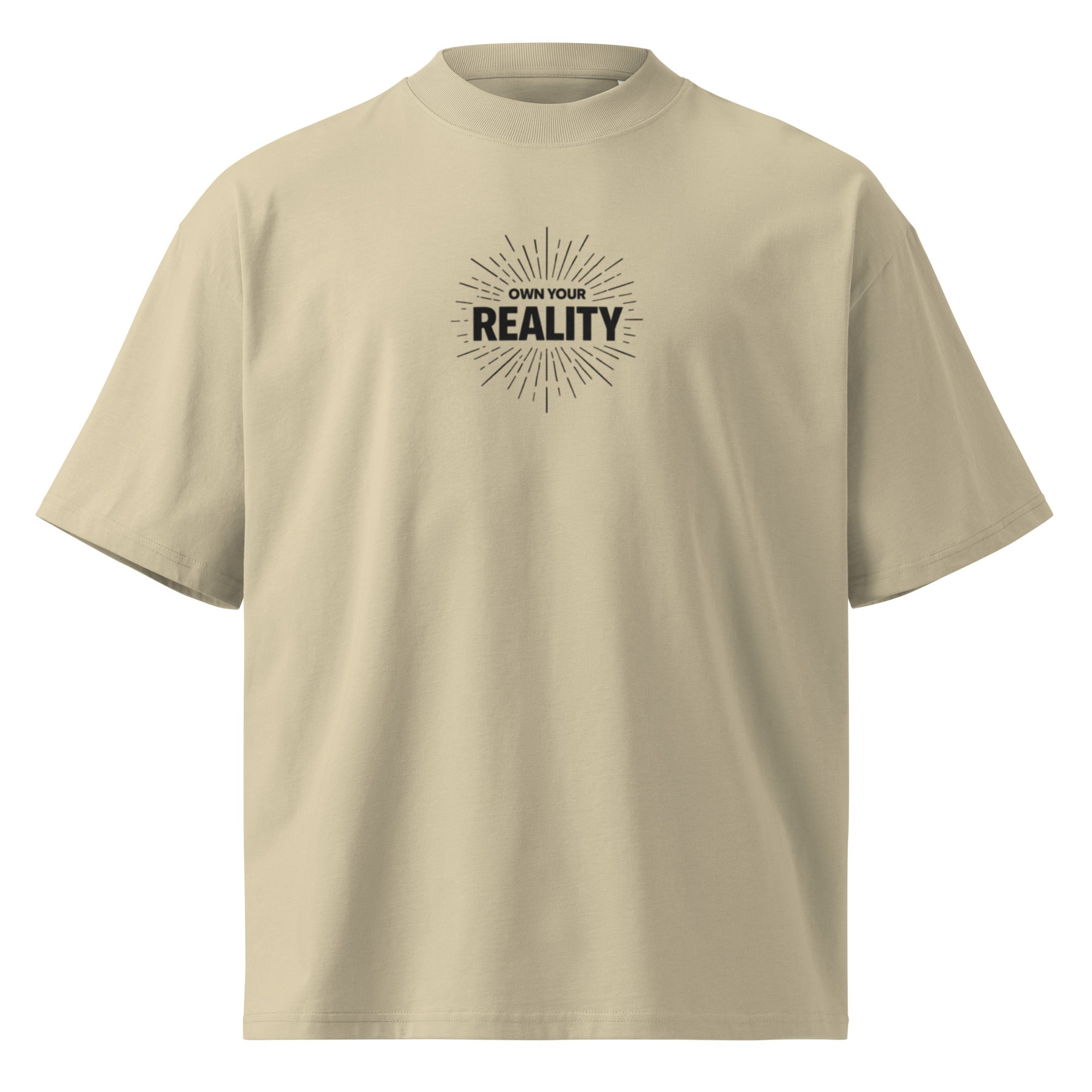 Beige oversized t-shirt front view with “Own Your Reality” minimal chest graphic and sunburst design, clean mockup