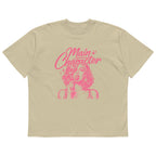 Sand beige women’s oversized t-shirt flat lay with bold pink “Main Character” statement graphic, contemporary women’s streetwear t-shirt product photo.