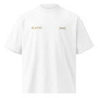 White oversized tee with small gold chest prints and clean minimalist design