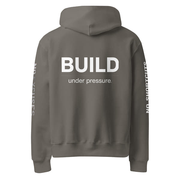 Asphalt unisex oversized hoodie with “Build Under Pressure” statement printed on back, streetwear hoodie back view.