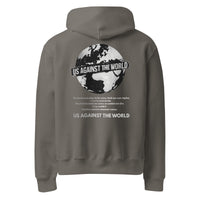 Grey unisex hoodie featuring “Us Against the World” world map graphic on the back, urban streetwear style
