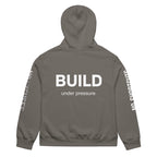 Grey hoodie with large BUILD back typography print, rear view – contemporary streetwear by Noiré.