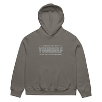 unisex streetwear hoodie front view with “compare just with yourself” motivational quote print
