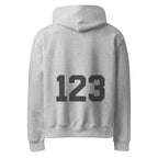 Light grey Noiré hoodie with oversized “123” back graphic, rear view, minimalist apparel mockup.