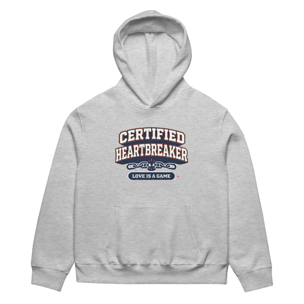 Athletic heather hoodie front view with “Certified Heartbreaker” varsity-style graphic and “Love Is a Game” slogan in red and navy collegiate typography.