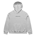 Light grey women’s oversized hoodie with “More Than You See” front text print, minimalist women’s streetwear hoodie product photo.
