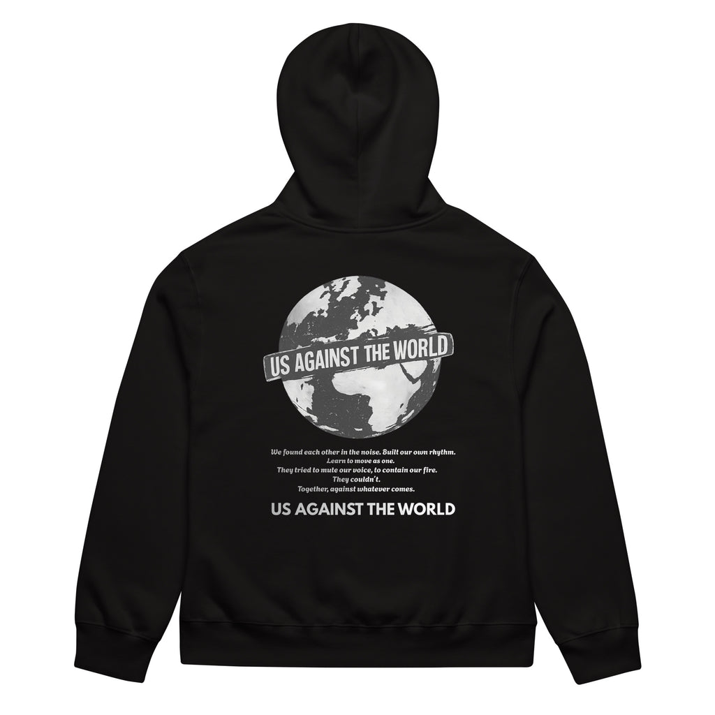 Black unisex hoodie with “Us Against the World” globe graphic print on the back, urban streetwear sweatshirt