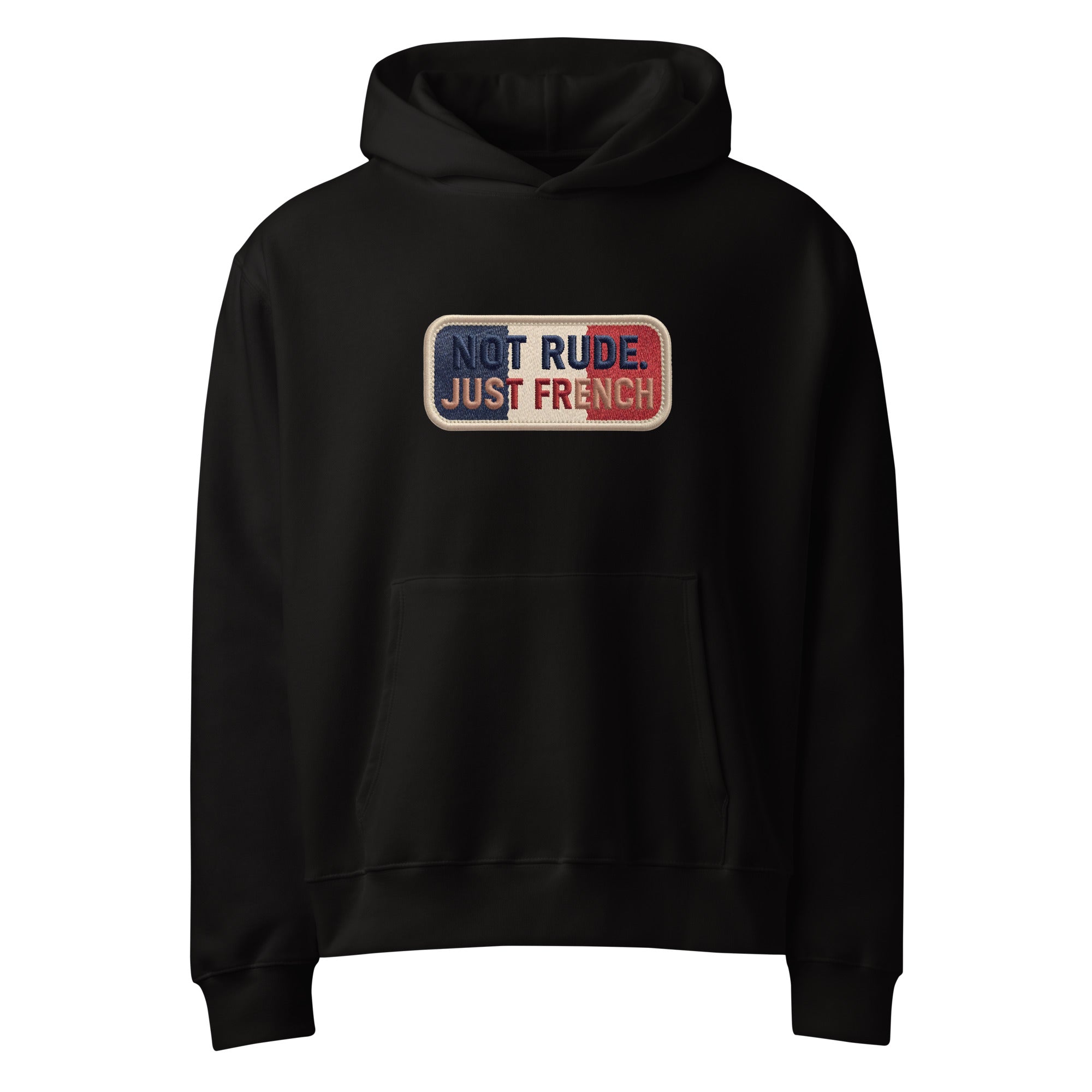 Black oversized hoodie with “Not Rude Just French” statement patch, front view