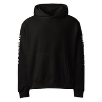 Black unisex oversized streetwear hoodie front view with minimalist design and printed sleeves.