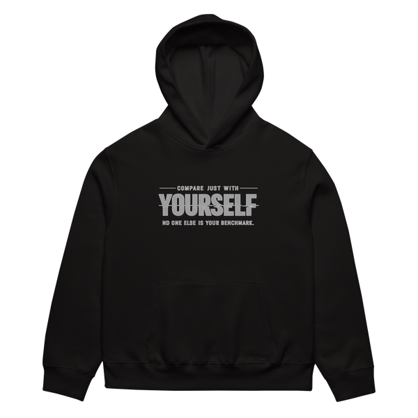 unisex streetwear hoodie front view with “compare just with yourself” motivational quote print
