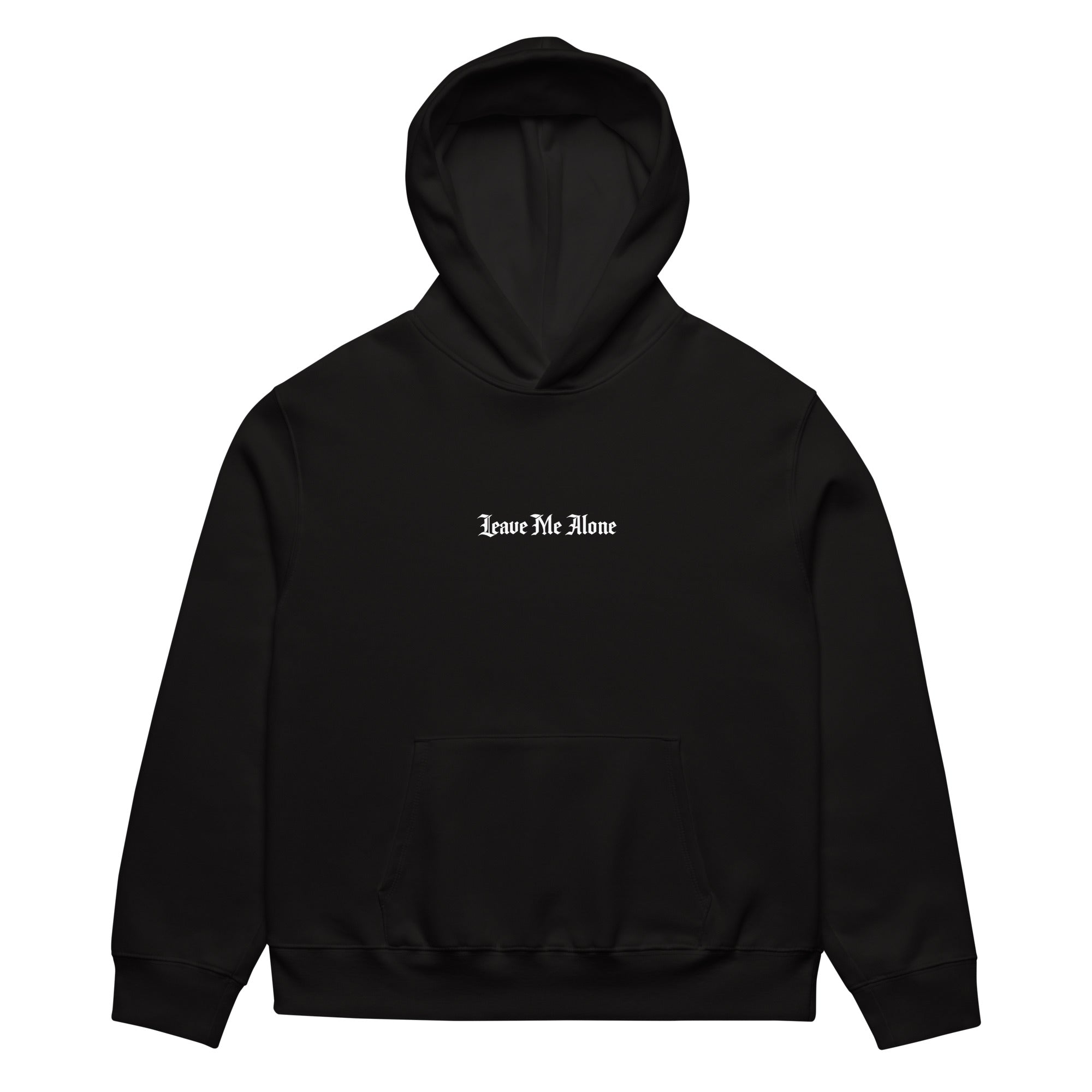Front view of black oversized streetwear hoodie with small “Leave Me Alone” chest text print, minimalist unisex casual sweatshirt