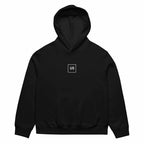 front view oversized black graphic streetwear hoodie minimal chest logo streetwear fashion