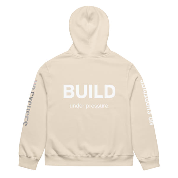 Dust unisex oversized hoodie with “Build Under Pressure” statement printed on back, streetwear hoodie back view.