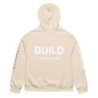 Dust unisex oversized hoodie with “Build Under Pressure” statement printed on back, streetwear hoodie back view.