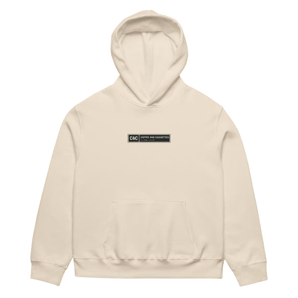 unisex streetwear hoodie front view with minimalist chest logo and coffee club typography design
