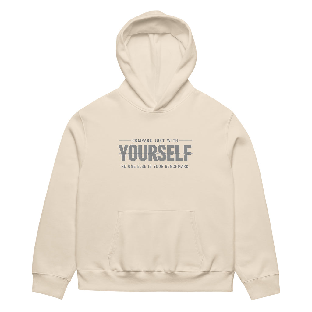 unisex streetwear hoodie front view with “compare just with yourself” motivational quote print
