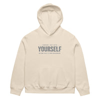 unisex streetwear hoodie front view with “compare just with yourself” motivational quote print
