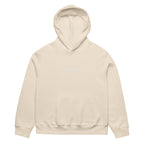 Front view of dust oversized streetwear hoodie with small “Leave Me Alone” chest text print, minimalist unisex casual sweatshirt