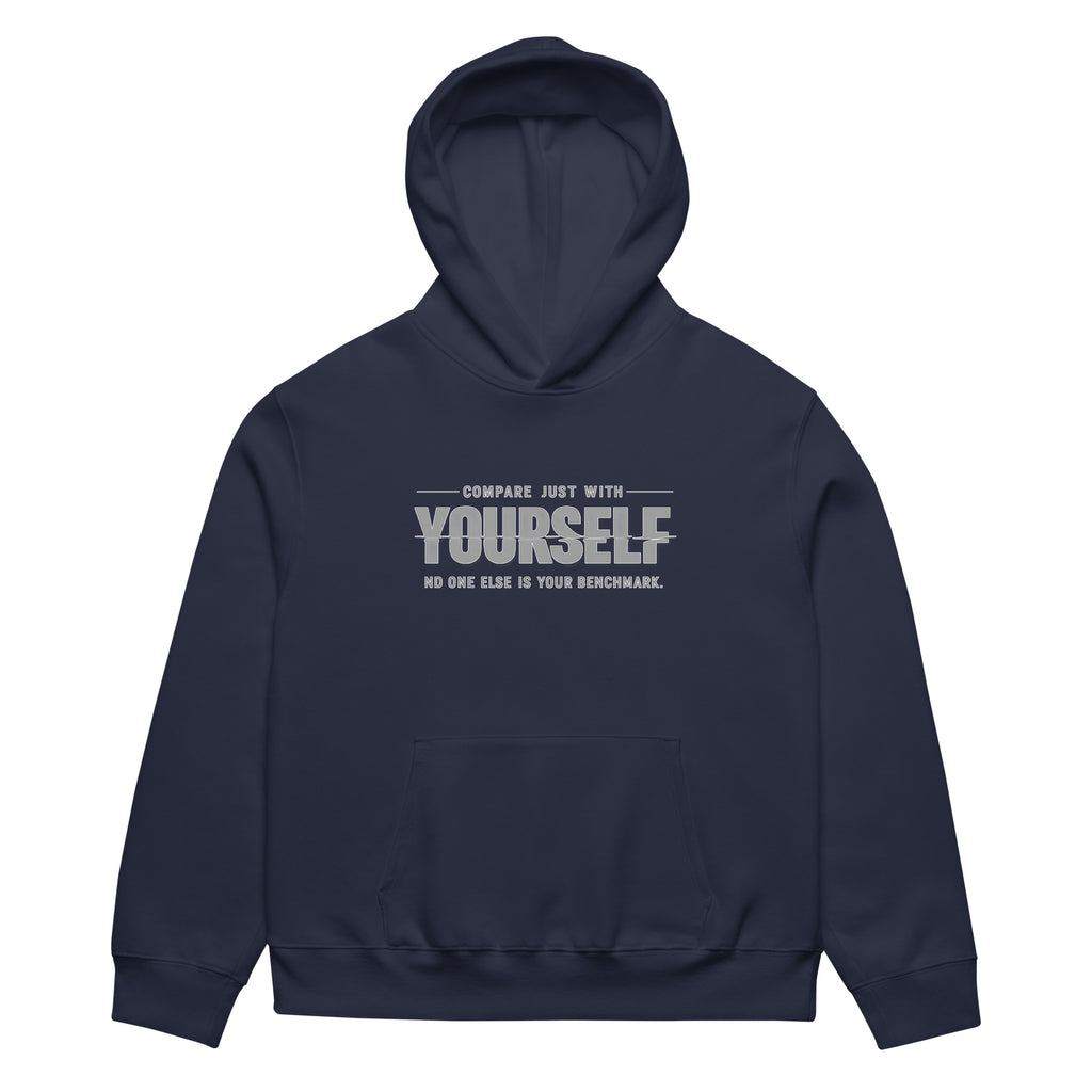 unisex streetwear hoodie front view with “compare just with yourself” motivational quote print
