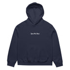 Front view of navy oversized streetwear hoodie with small “Leave Me Alone” chest text print, minimalist unisex casual sweatshirt