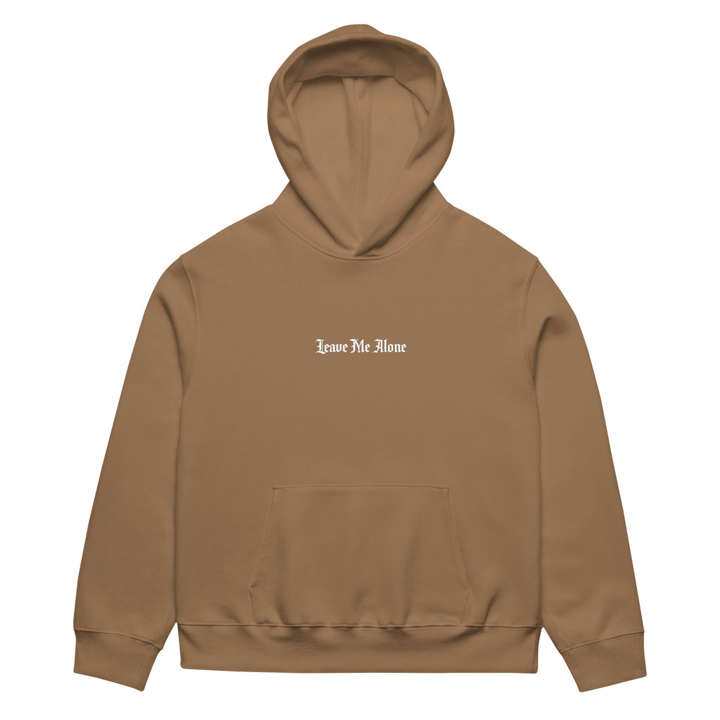 Front view of vintage brown oversized streetwear hoodie with small “Leave Me Alone” chest text print, minimalist unisex casual sweatshirt