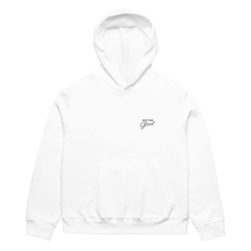 White unisex streetwear hoodie front view with minimalist chest logo and “See The Good” message
