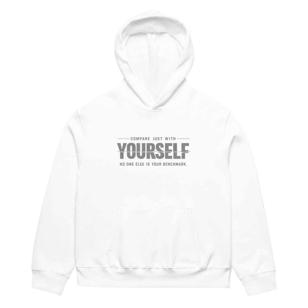 unisex streetwear hoodie front view with “compare just with yourself” motivational quote print
