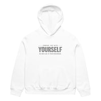 unisex streetwear hoodie front view with “compare just with yourself” motivational quote print
