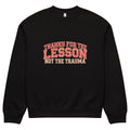 Black unisex sweatshirt front view with “Thanks for the Lesson, Not the Trauma” motivational typography print, modern streetwear pullover