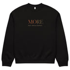Black oversized heavyweight sweatshirt with “MORE Isn’t Always Better” statement print, unisex streetwear