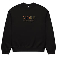 Black oversized heavyweight sweatshirt with “MORE Isn’t Always Better” statement print, unisex streetwear