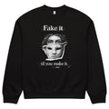 Black unisex sweatshirt front view with illustrated face graphic and “Fake it til you make it” slogan, modern streetwear crewneck