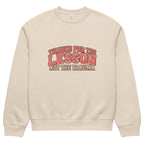 Beige unisex sweatshirt front view with “Thanks for the Lesson, Not the Trauma” motivational typography print, modern streetwear pullover