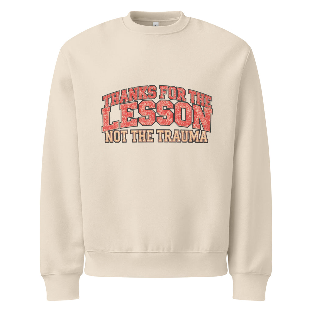 Beige unisex sweatshirt front view with “Thanks for the Lesson, Not the Trauma” motivational typography print, modern streetwear pullover