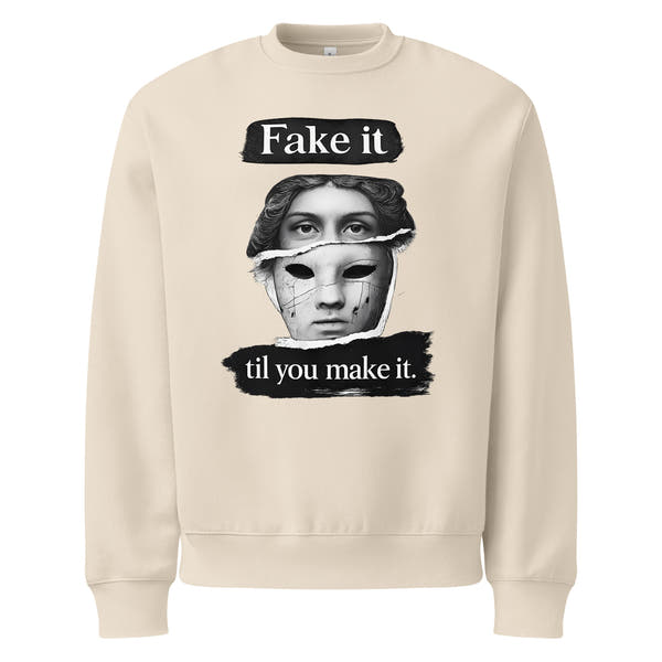 Beige unisex sweatshirt front view with bold illustrated face print and motivational slogan, contemporary streetwear style