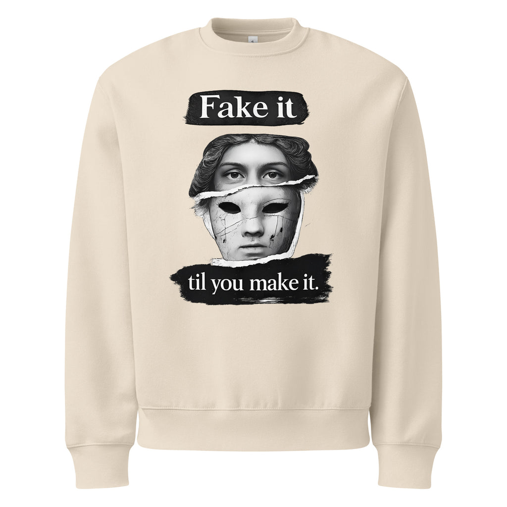 Beige unisex sweatshirt front view with bold illustrated face print and motivational slogan, contemporary streetwear style