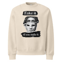 Beige unisex sweatshirt front view with bold illustrated face print and motivational slogan, contemporary streetwear style
