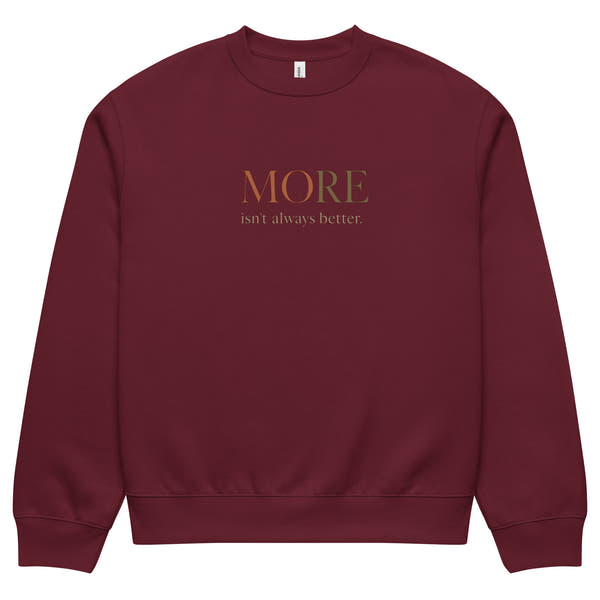 Maroon oversized heavyweight sweatshirt with “MORE Isn’t Always Better” slogan, statement streetwear piece