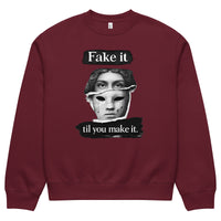Burgundy unisex sweatshirt front view with illustrated face graphic and motivational text print, modern streetwear sweatshirt