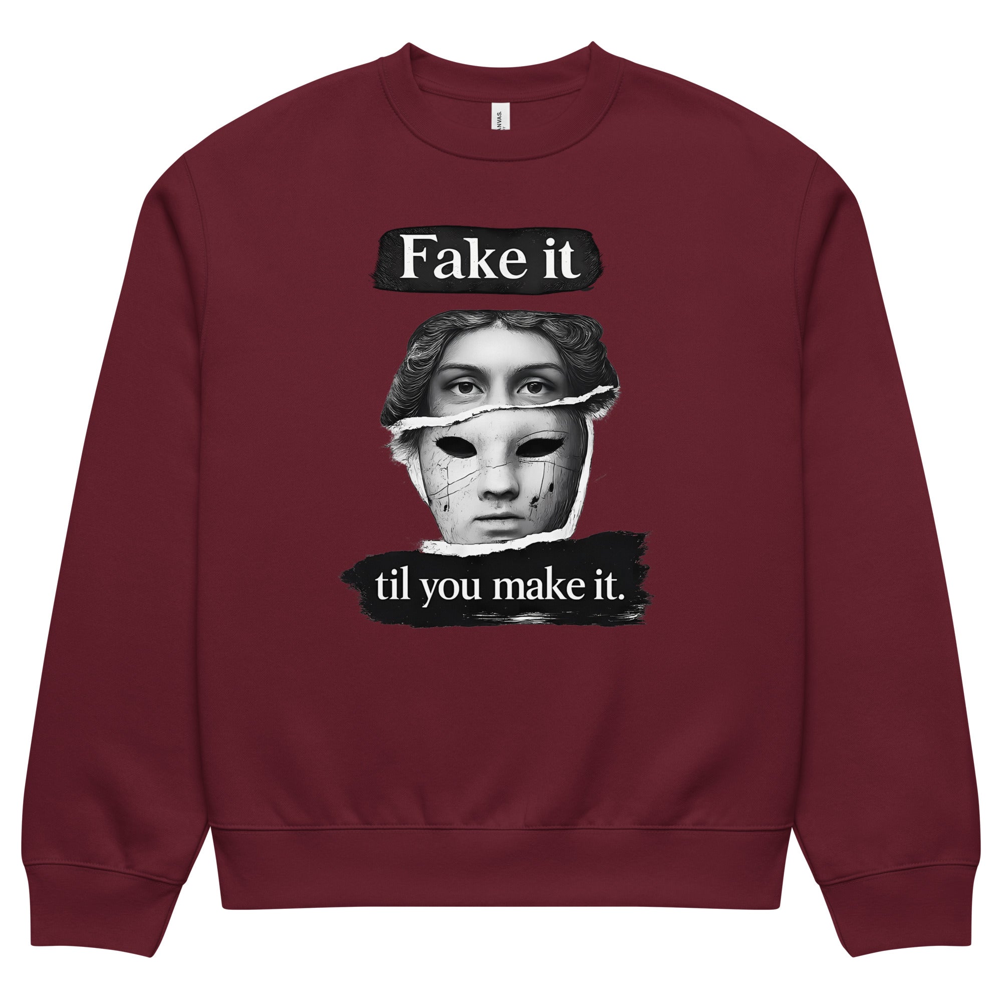 Burgundy unisex sweatshirt front view with illustrated face graphic and motivational text print, modern streetwear sweatshirt